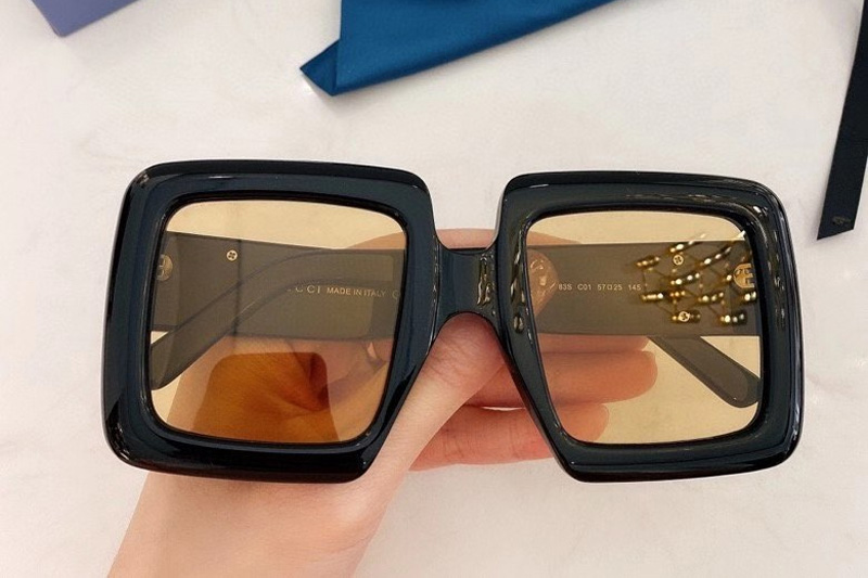 GG0783S Sunglasses In Black Gold Yellow Lens